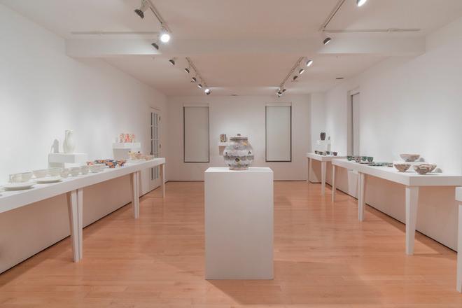 empty gallery space with pottery displayed